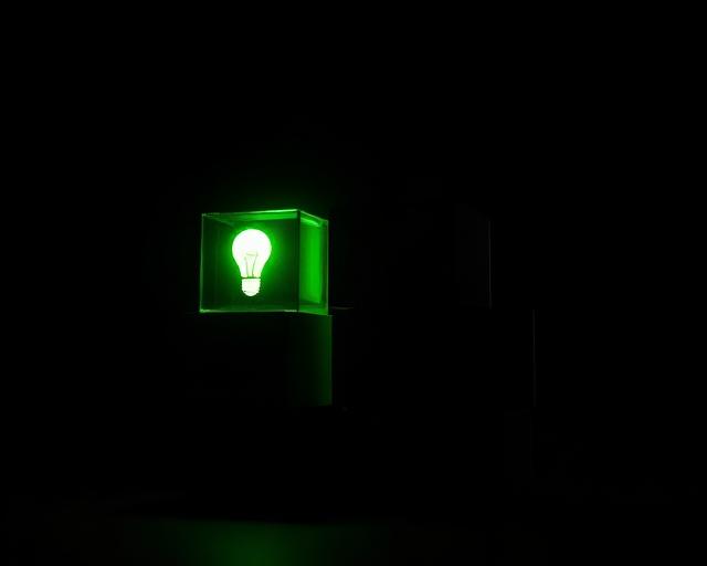 Glowing lime cube with a lightbulb inside